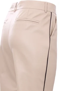 Pantaloni in ecopelle con piping laterale